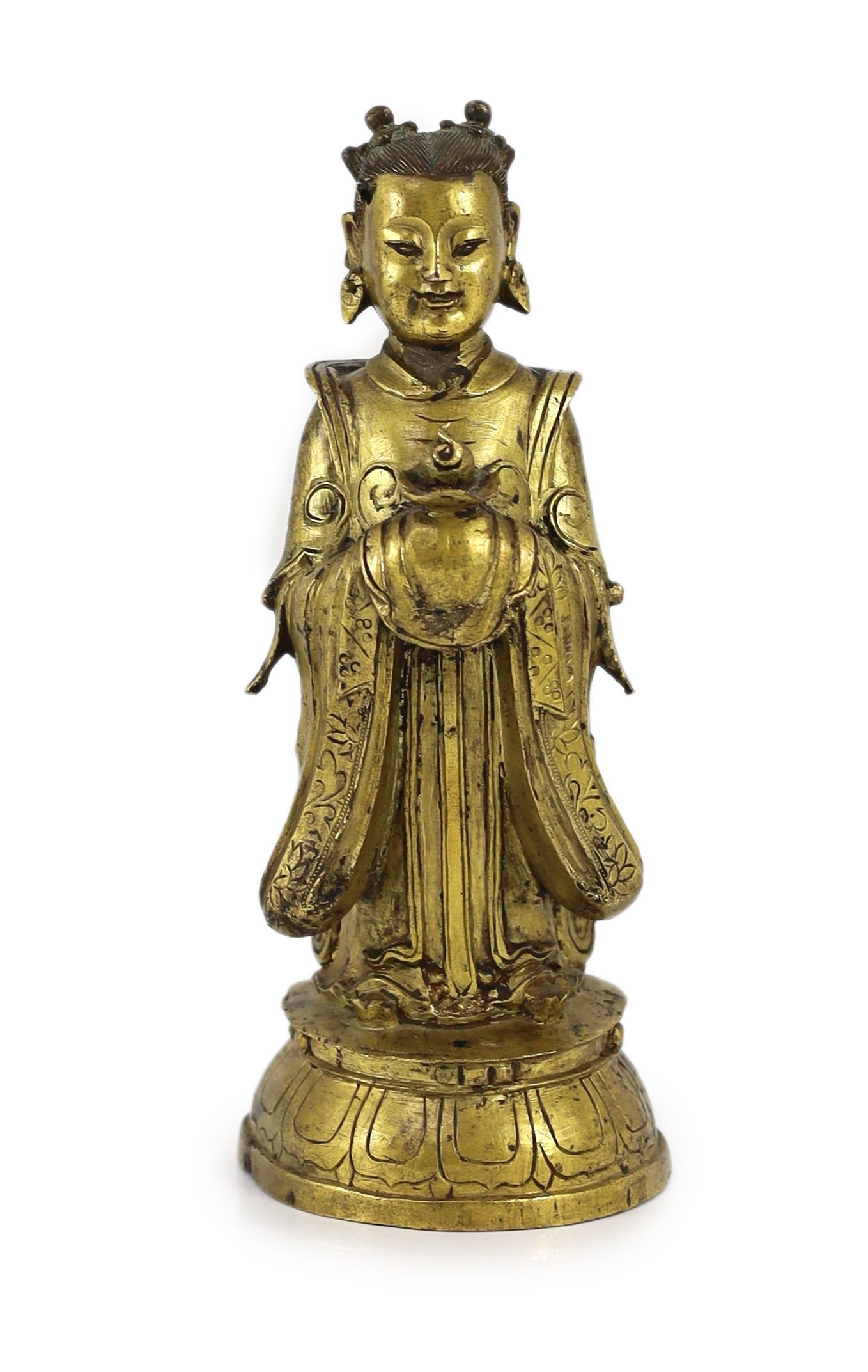 A Chinese Ming gilt bronze figure of an immortal, 16th/17th century, 24.5cm high
